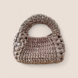 Bolso Bombón Piedra FW25/26 The Labbo — bolso artesanal sostenible en tonos piedra y plata.