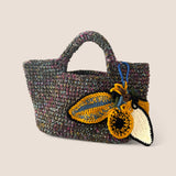 Detalle tejido melange mostaza Polar Bloom – lujo consciente