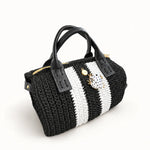 Vista lateral del bolso Bowling Urbana Negro y Blanco con ranita esmaltada