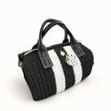 Vista lateral del bolso Bowling Urbana Negro y Blanco con ranita esmaltada