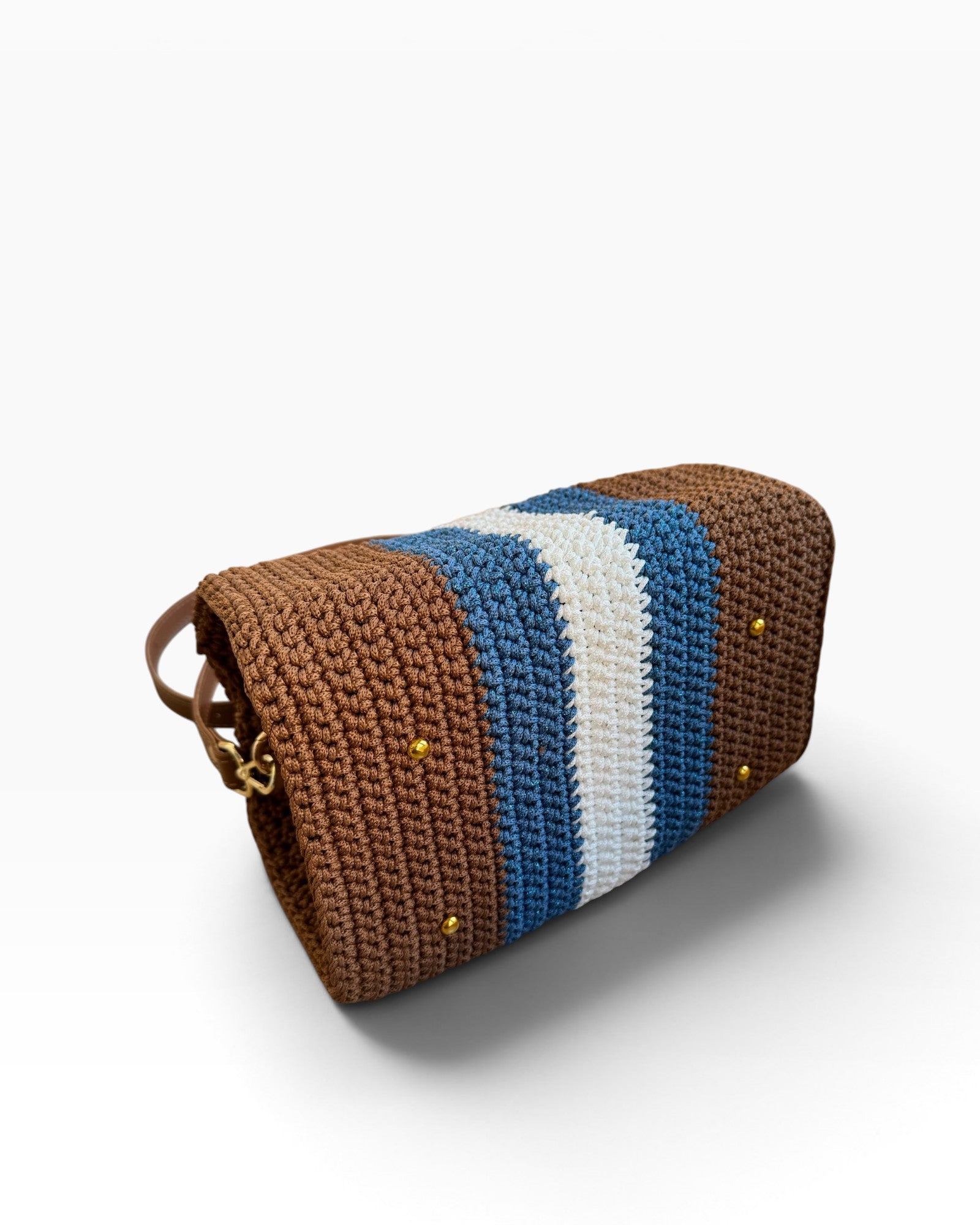 Base del bolso Bowling Urbana marrón con franjas azul y crudo y protectores dorados