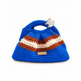 Clutch Urbana Blue by The Labbo, handmade in vivid blue, terracotta brown and ecru, with a yarn-covered handle and enamelled frog, front view.