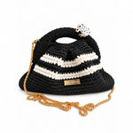 Clutch Urbana Black and White by The Labbo in black and white, with a gold-plated brass chain against a white background.