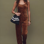 Fashion model walks forward, then stops sharply and holds the pose