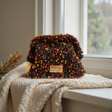 Clutch negro confetti sobre manta, lujo sostenible The Labbo